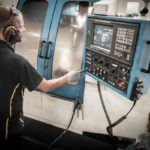 Toggle latch CNC machine operated by Ojop Sweden AB employee