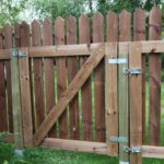 Toggle latches keeping brown color wooden fence segments together